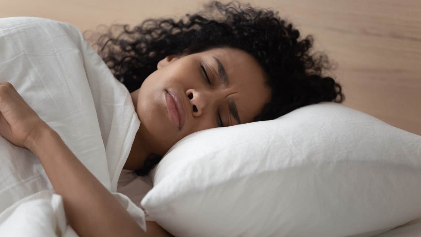 Spiritual Mentor Reveals What It Means When You Struggle To Speak In Your Dreams Woman having a bad dream in which she can't speak