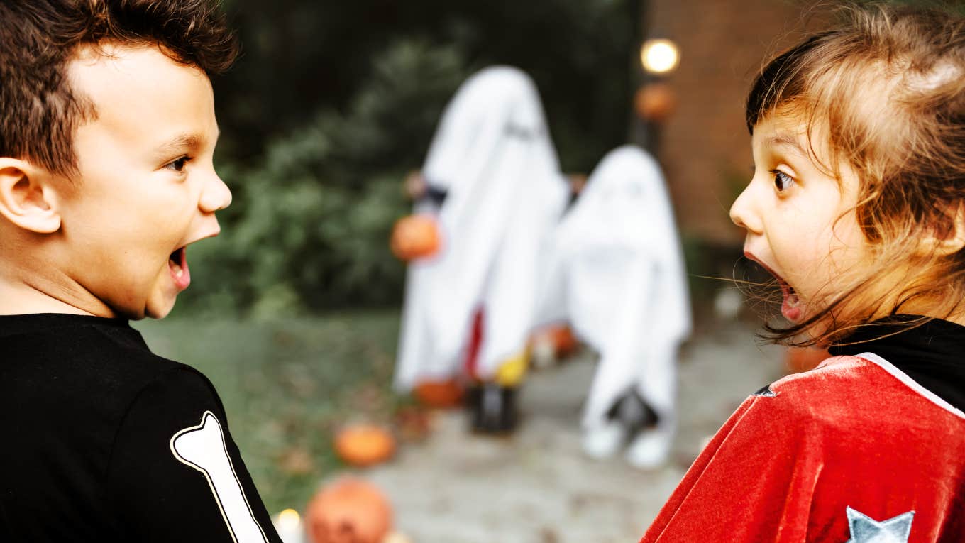 Spookiest Celebrations Around The World That Rival Halloween Kids being spooked on halloween night.