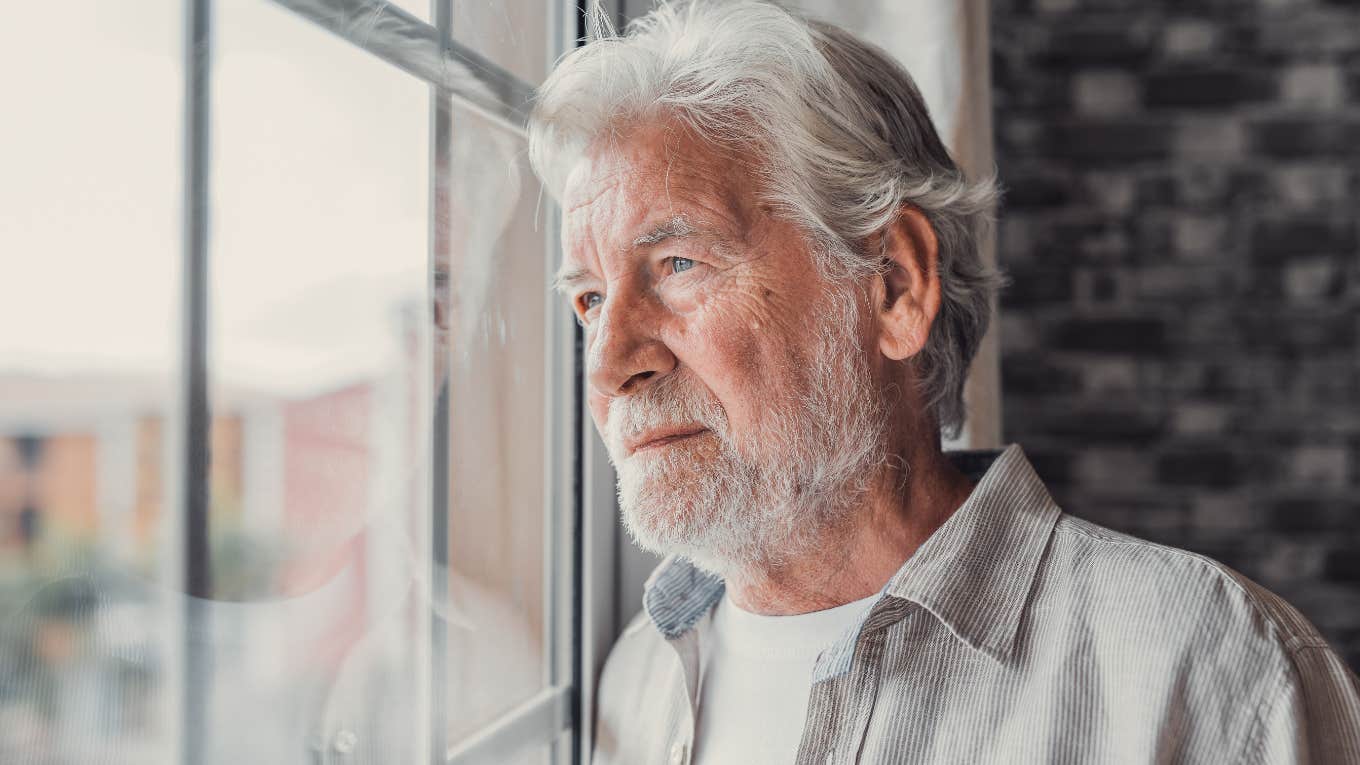 Traits Of Parents Whose Adult Kids Often Hate Them Once They Grow Up Older man looking sadly out of the window