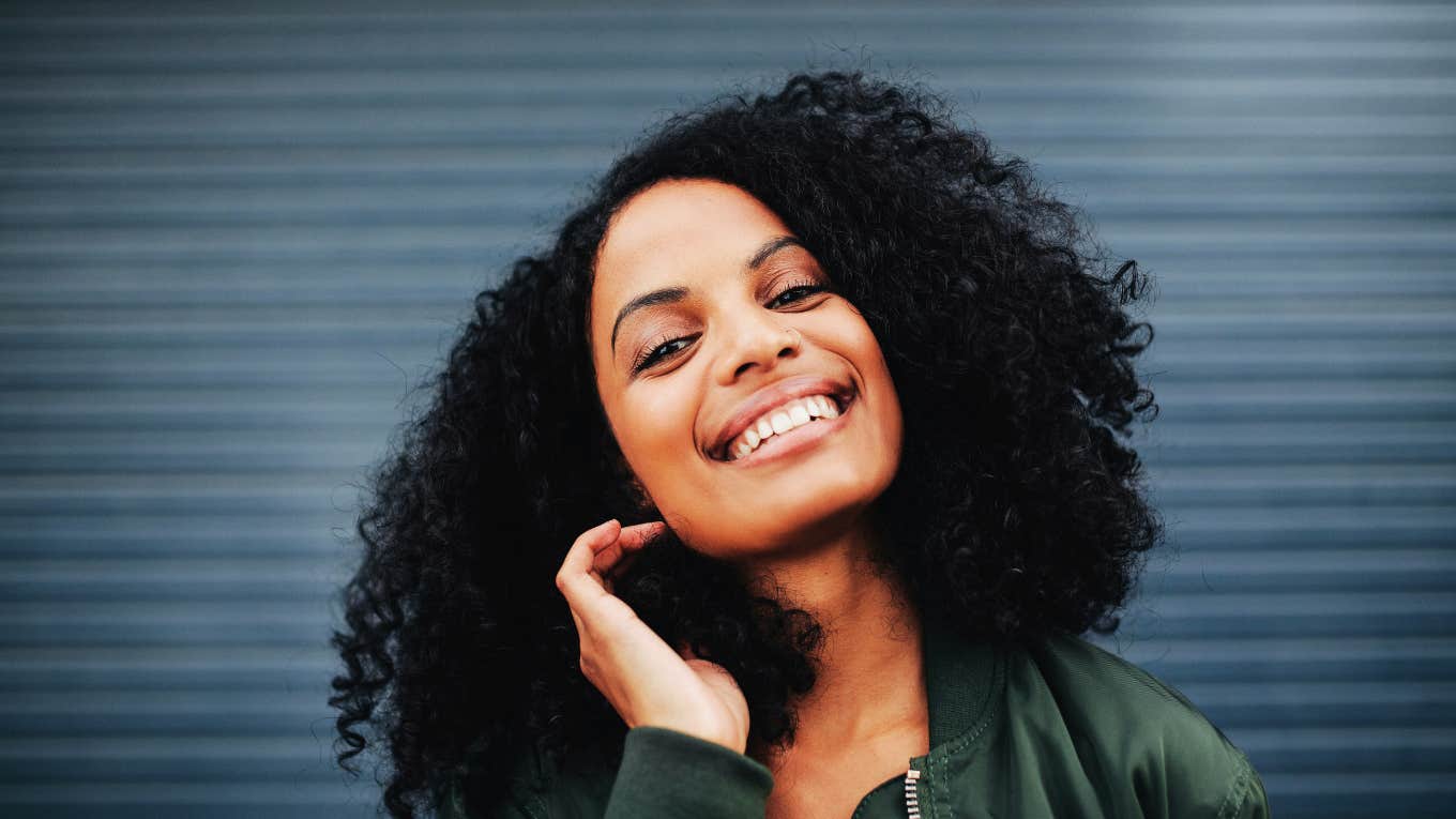 Common Traits Of People Who Tend To Always Succeed, According To Psychology Happy woman succeeding in life.