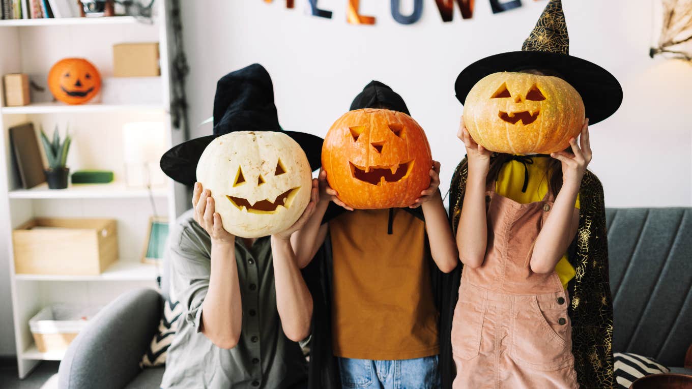 Unhoused Woman Slams Parents Who Dressed Their Son As Homeless Person For Halloween family with witch hats and jack-o-lanterns over their faces