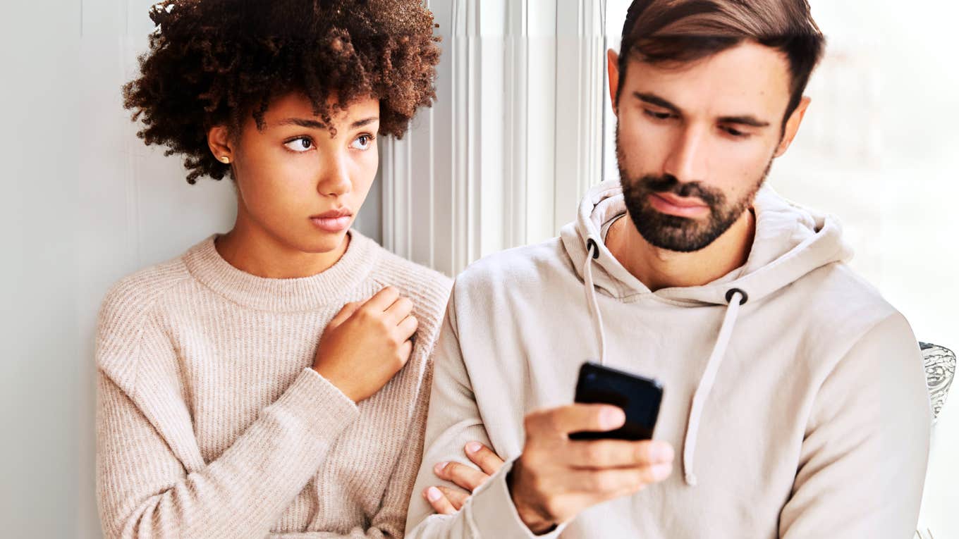What To Do If You Feel Like Your Husband Loves You But Isn't 'In Love' With You Woman feeling like husband isn't into her.