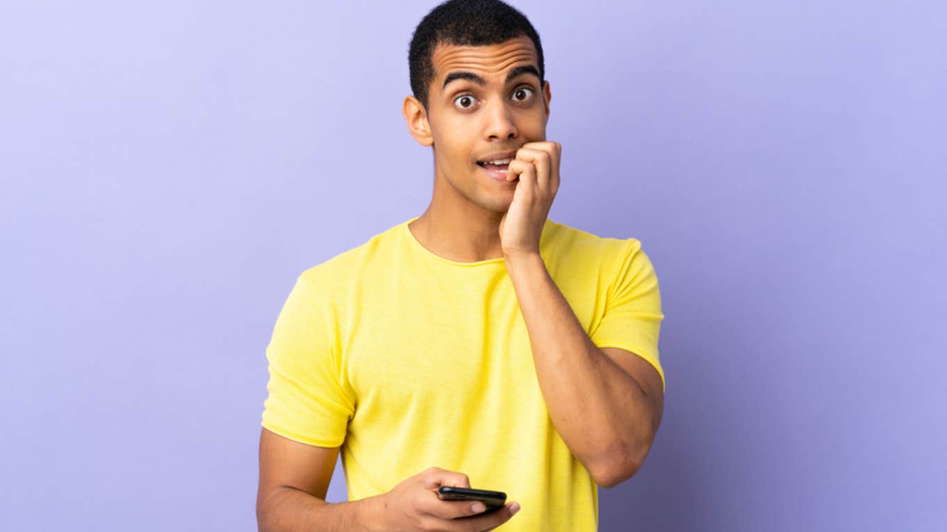 Mom Forces 22-Year-Old Son To Finally Start Making His Own Doctor Appointments And He Still Needs Help nervous young man using phone