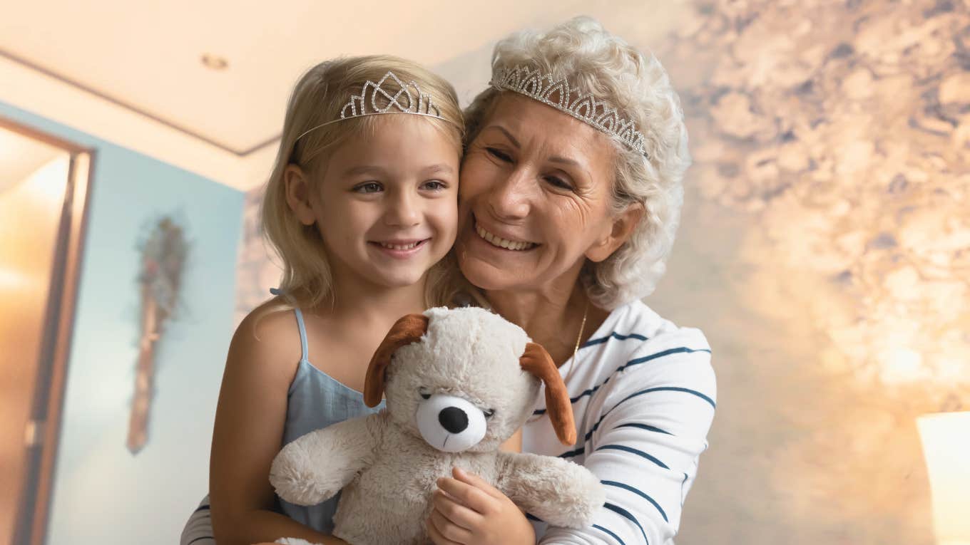 I chose not to have children Elderly woman who didn't have children playing with a young child