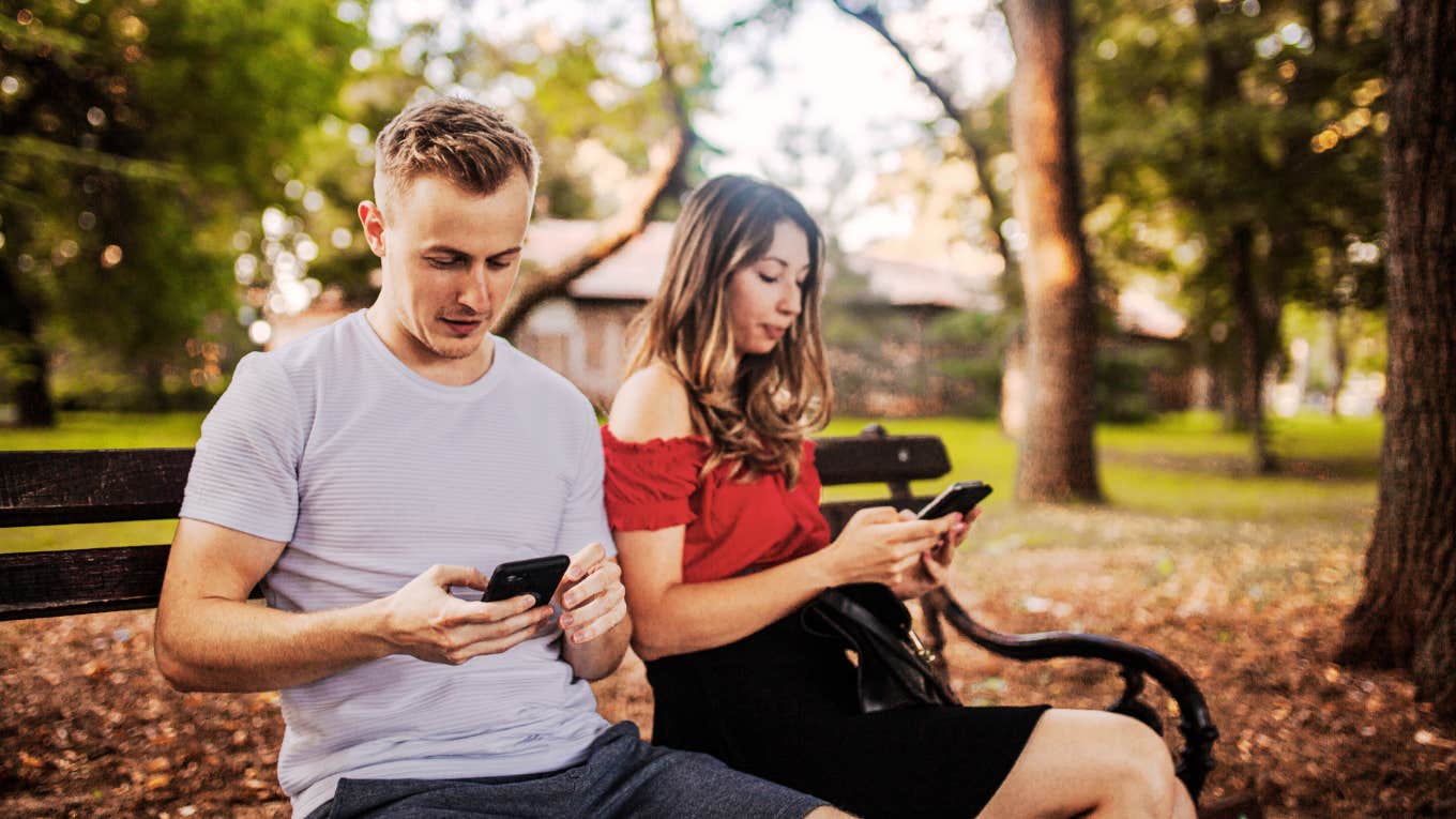 Psychology Says There's Factors That End Someone's Attraction To You, No Matter How Pretty You Are Couple ignoring each other, on their phones.
