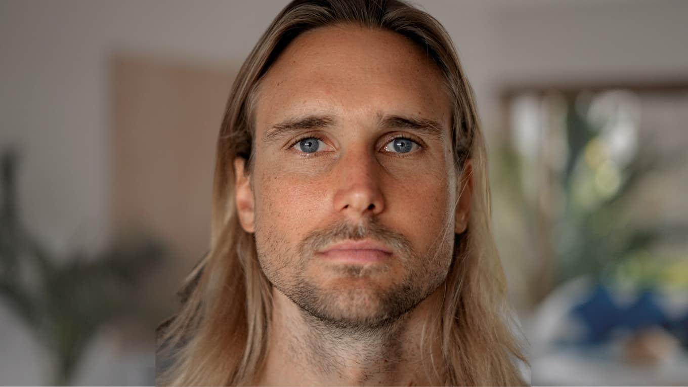Subtle Gaslighting Phrases People Say To Make You Question Your Reality Gaslighting man looking upset staring directly at the camera.