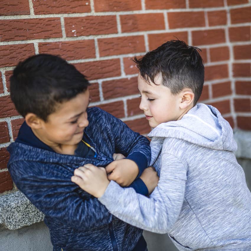 Kid bullying another boy