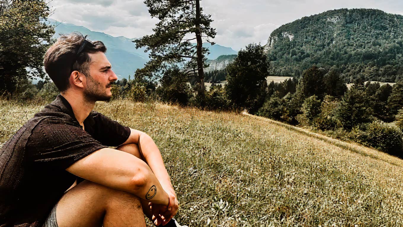 What Losing My Sight Taught Me About Life Author sitting in the grass on a beautiful day.