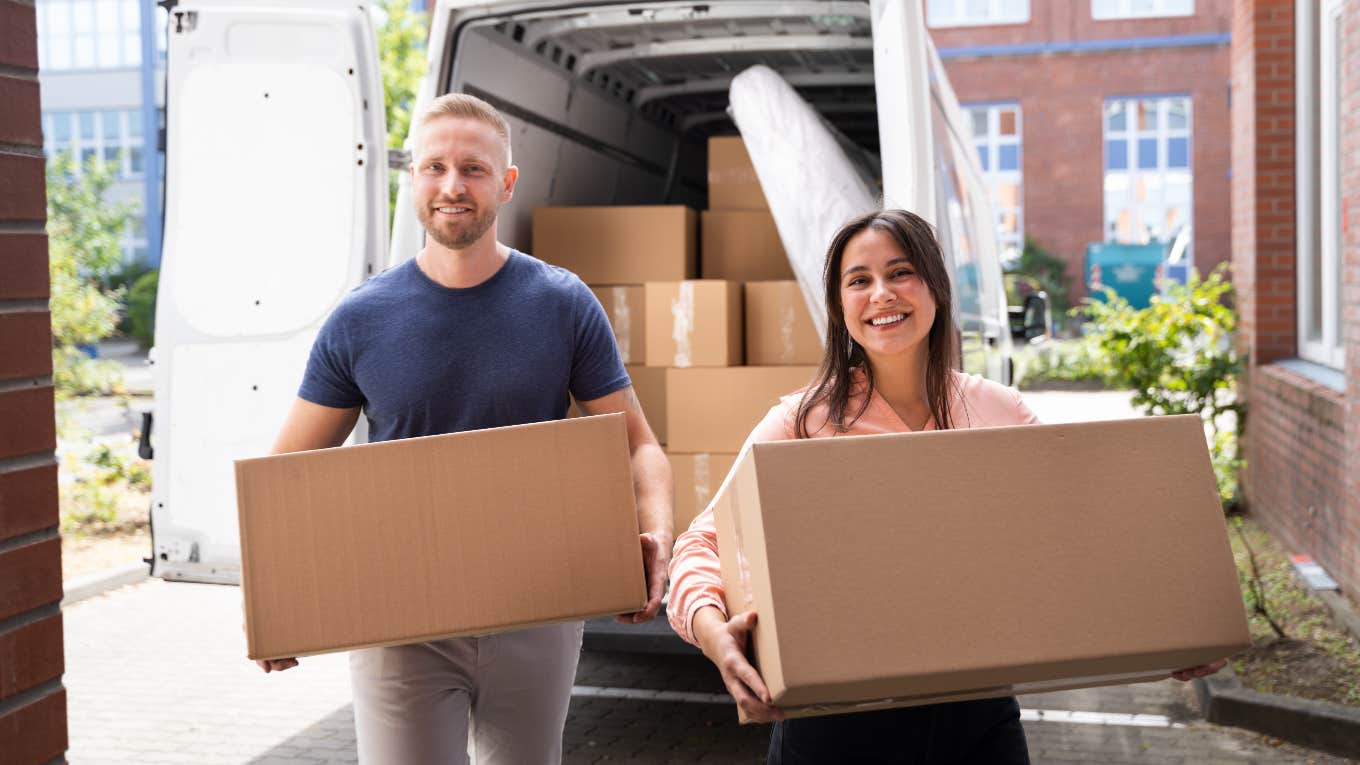 Couple unloading moving truck at their new home with squatters