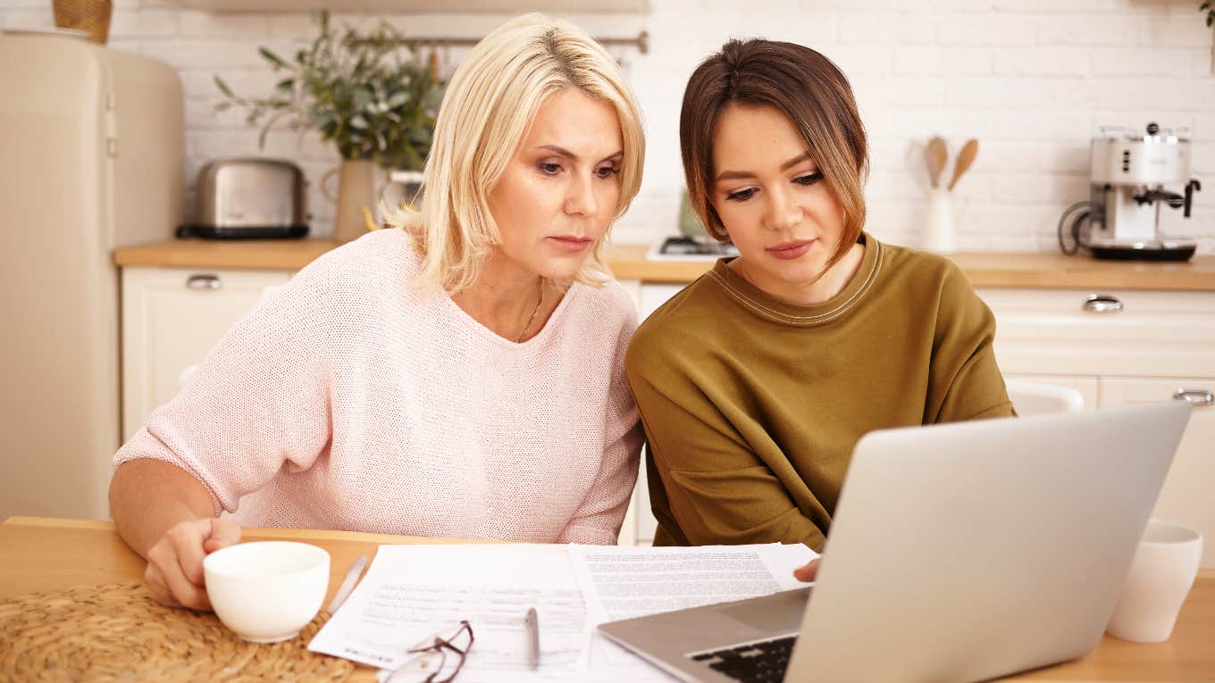 Mom Considers Getting A Divorce And Quitting Her Job So Her Kid Can Afford College Mom and daughter looking at college scholarships