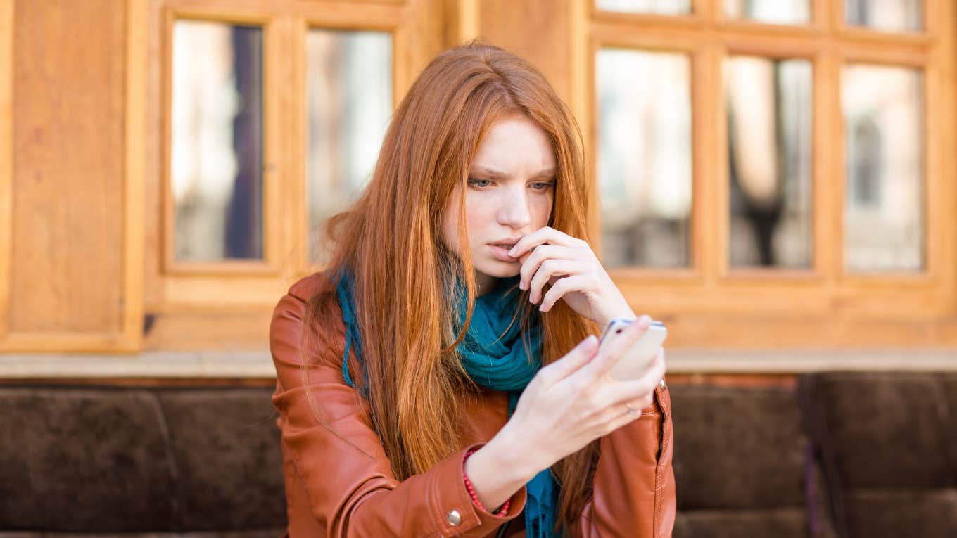 Neuroscientist Explains Why You Can't Change Anyone's Mind Once They've Heard Something Online Woman looking at online content on her phone
