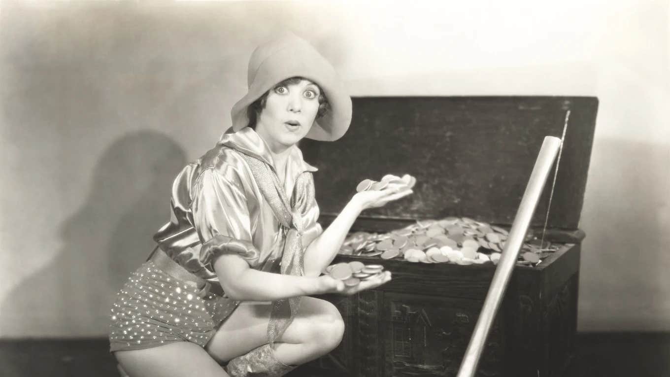 Old-Fashioned Money Habits That Need To Make A Comeback Old-fashioned photo of woman with money
