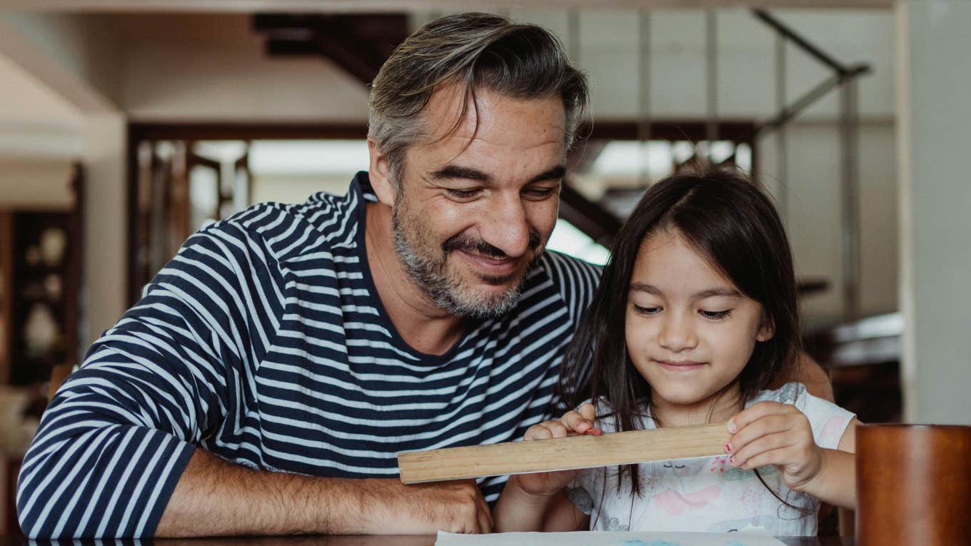 7 Phrases Kind Parents Who Raise Respectful Kids Use Often Father and daughter looking at wooden ruler