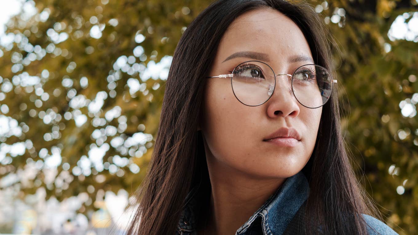 Phrases Parents Say That Can Push Their Adult Kids Away For Good Asian girl wearing glasses and having a photoshoot in the park.