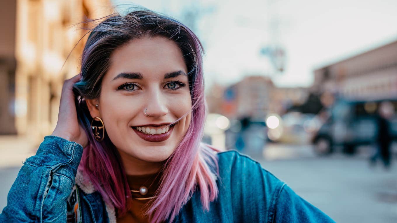 Phrases People Use When They Have True Integrity smiling woman with pink hair
