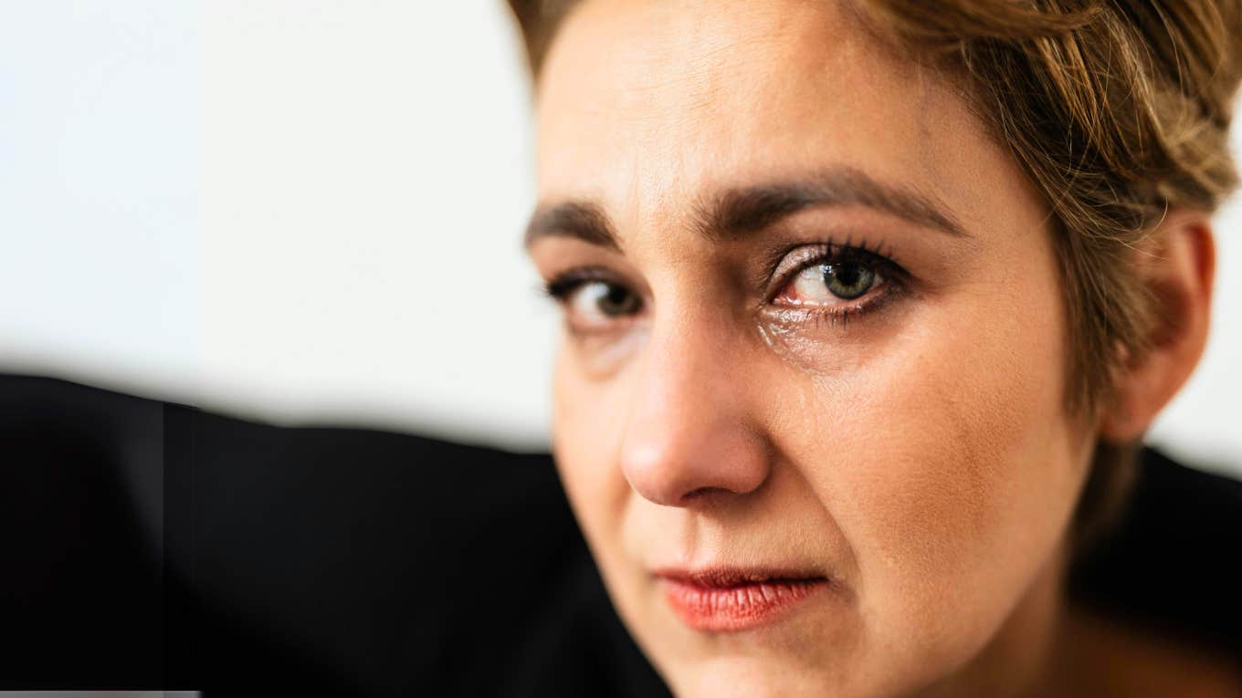 Psychology Says If You Can Let This One Big Emotion Go, You'll Be Happier & Healthier Woman letting go of big emotions.