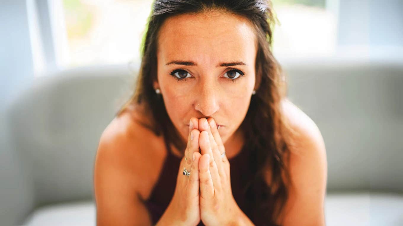 Signs You Have Eldest Daughter Syndrome And It's Still Affecting You As An Adult eldest daughter looking sad and anxious