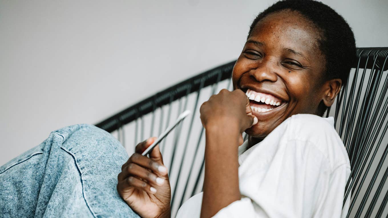 Strange Habits Of People Who Are Extremely Likable, According To Psychology Extremely likable person with inviting smile.