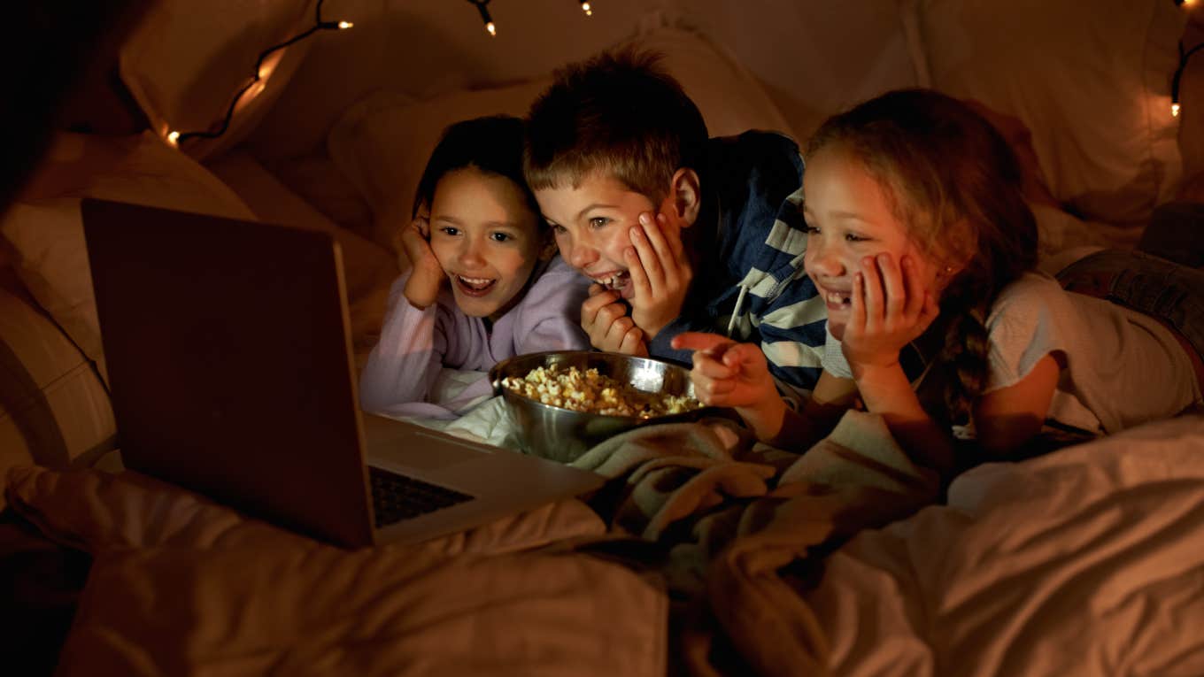 Teacher Says Student's Mom Should Invite Son's Classmates To Her Apartment For Birthday Sleepover Shot of three young children using a laptop in a blanket fort