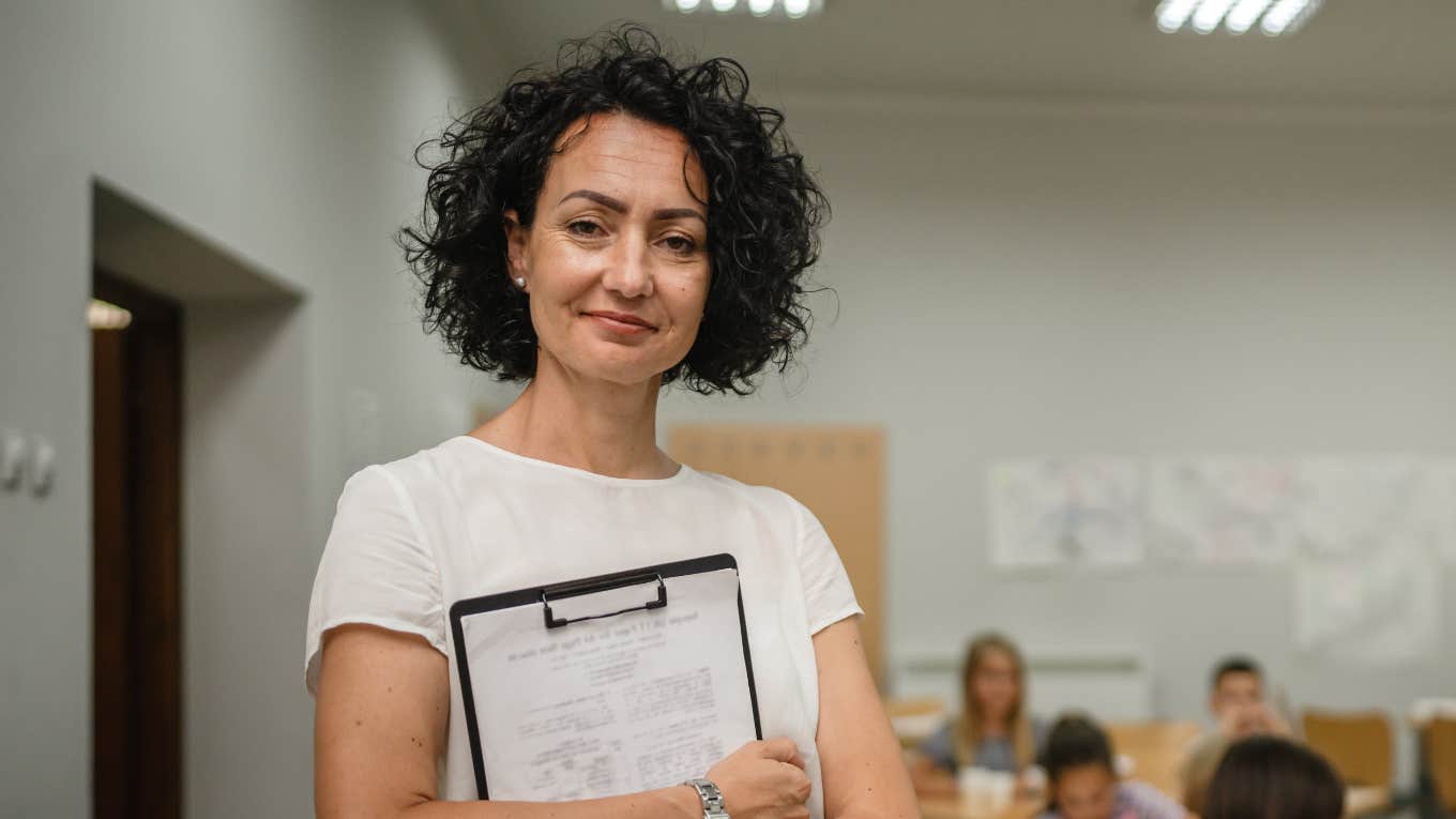 Teacher Tells A Parent She And Her Child Have A Bad Attitude Teacher standing before a class