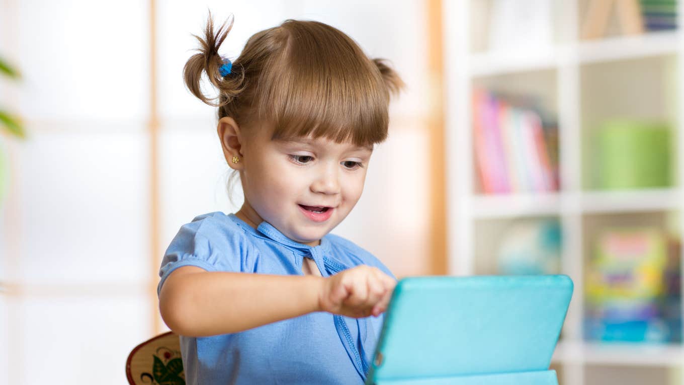 Things That Come Easier To Kids With Limited Screen Time Cute little girl using iPad