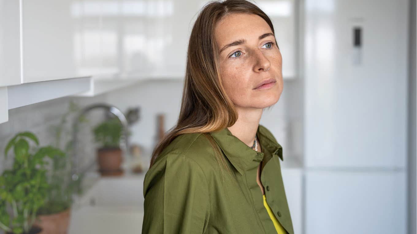 Things That Were Affordable 10 Years Ago That The Middle Class Can’t Afford Anymore Middle-aged woman looking sad in her kitchen.
