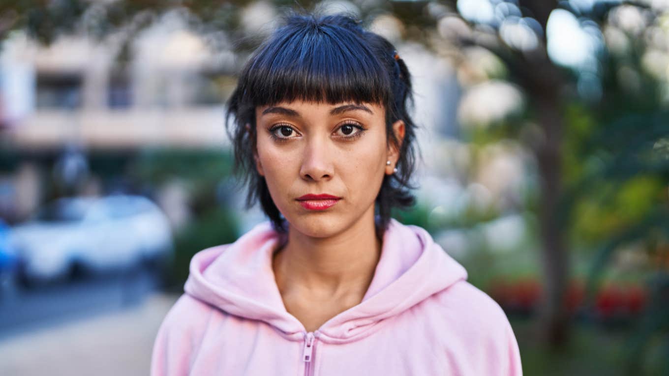 Types Of Women Who Make Very Bad Daughters young serious woman in pink sweater