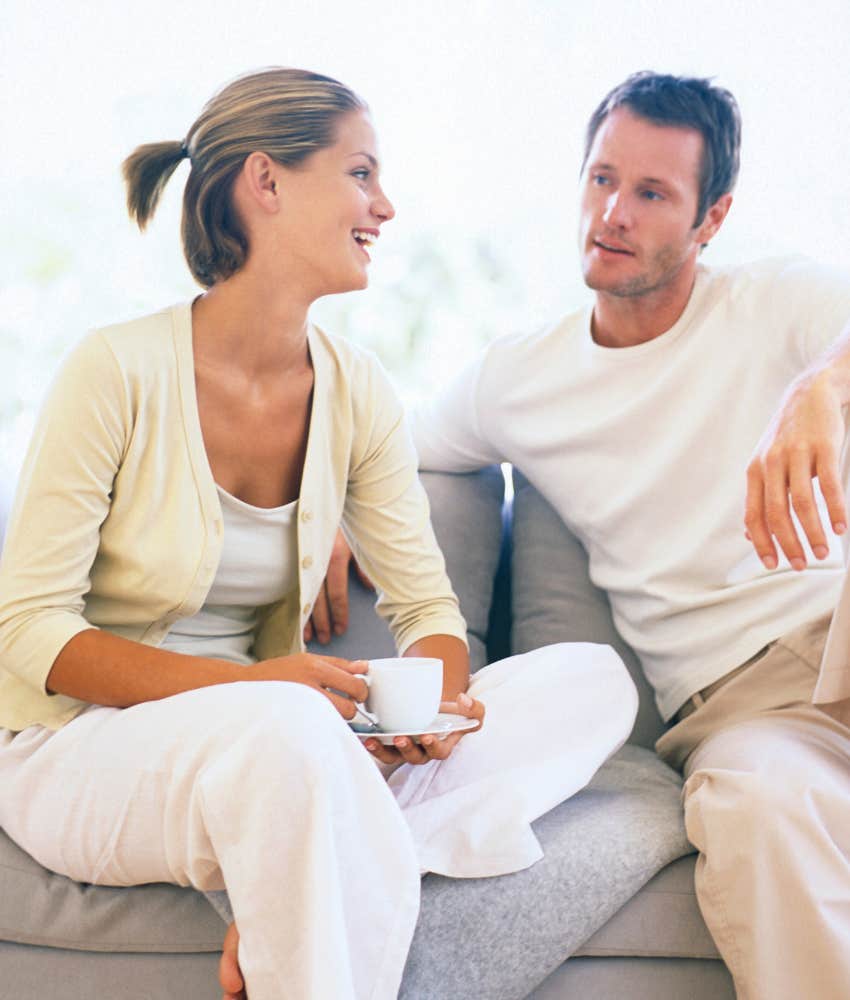 couple talking about adoption while sitting on a couch