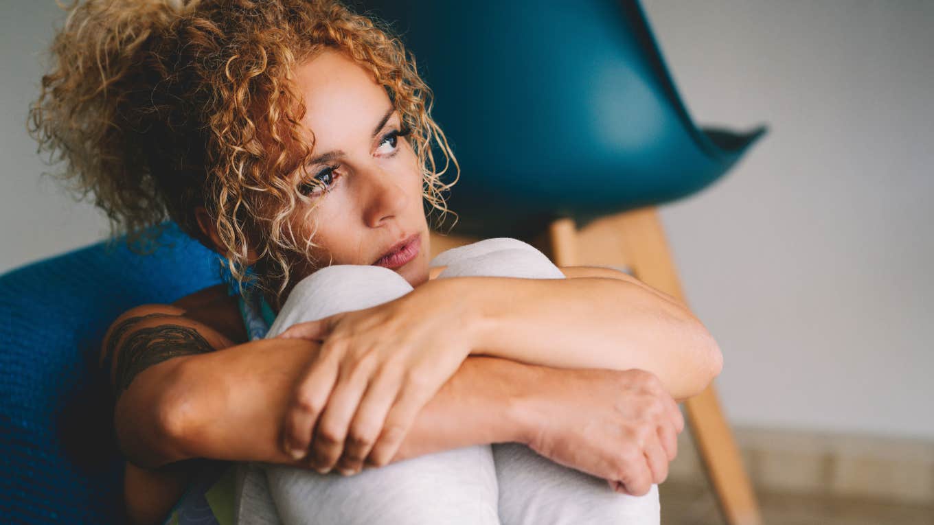 Woman reflecting on marriage while alone.