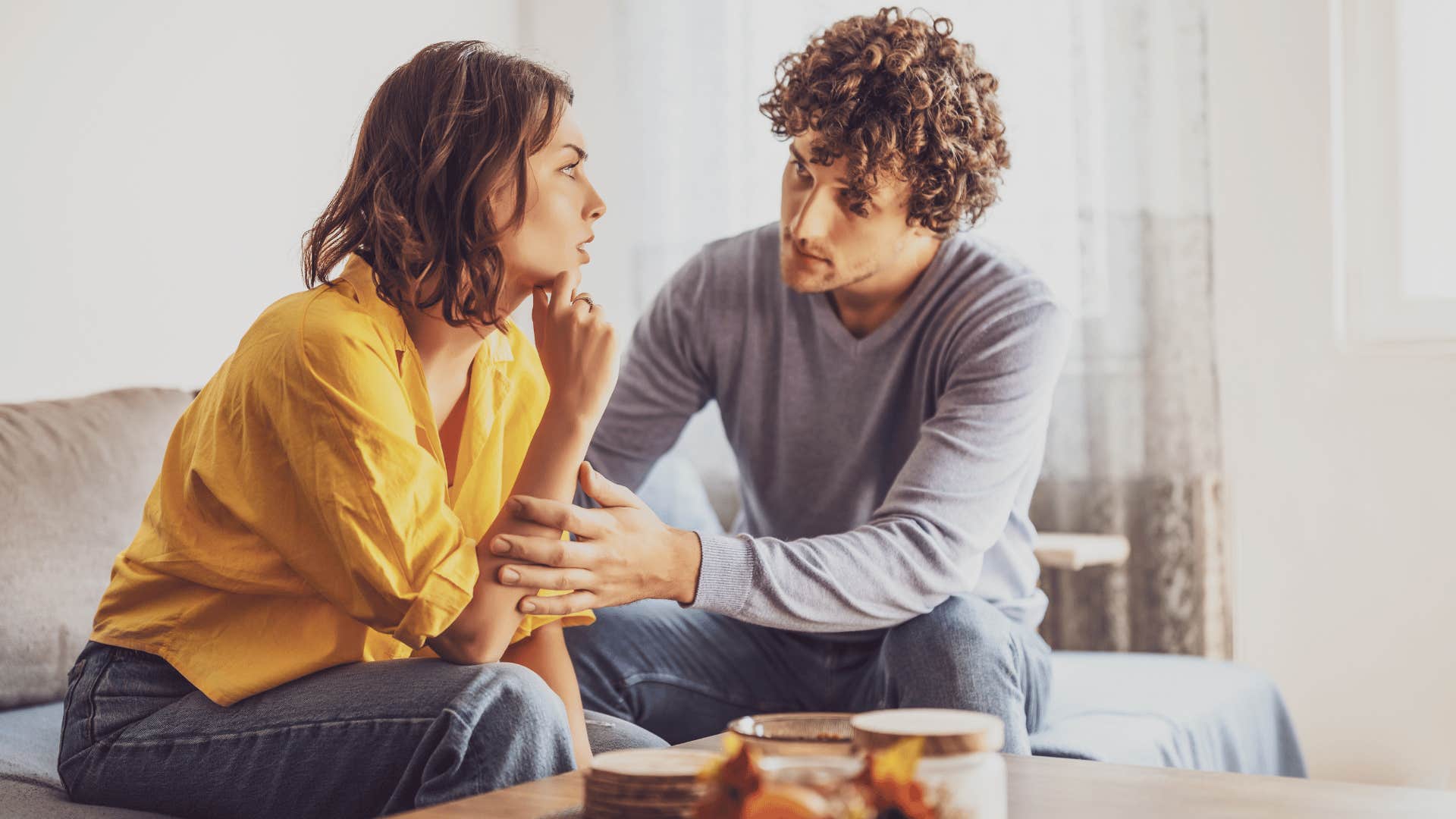 man comforting woman