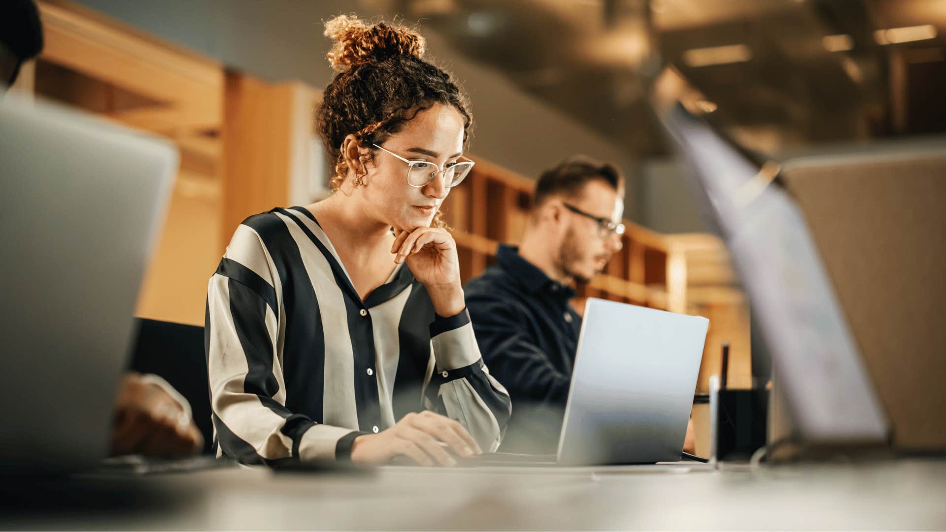 woman working on laptop and extremely focused