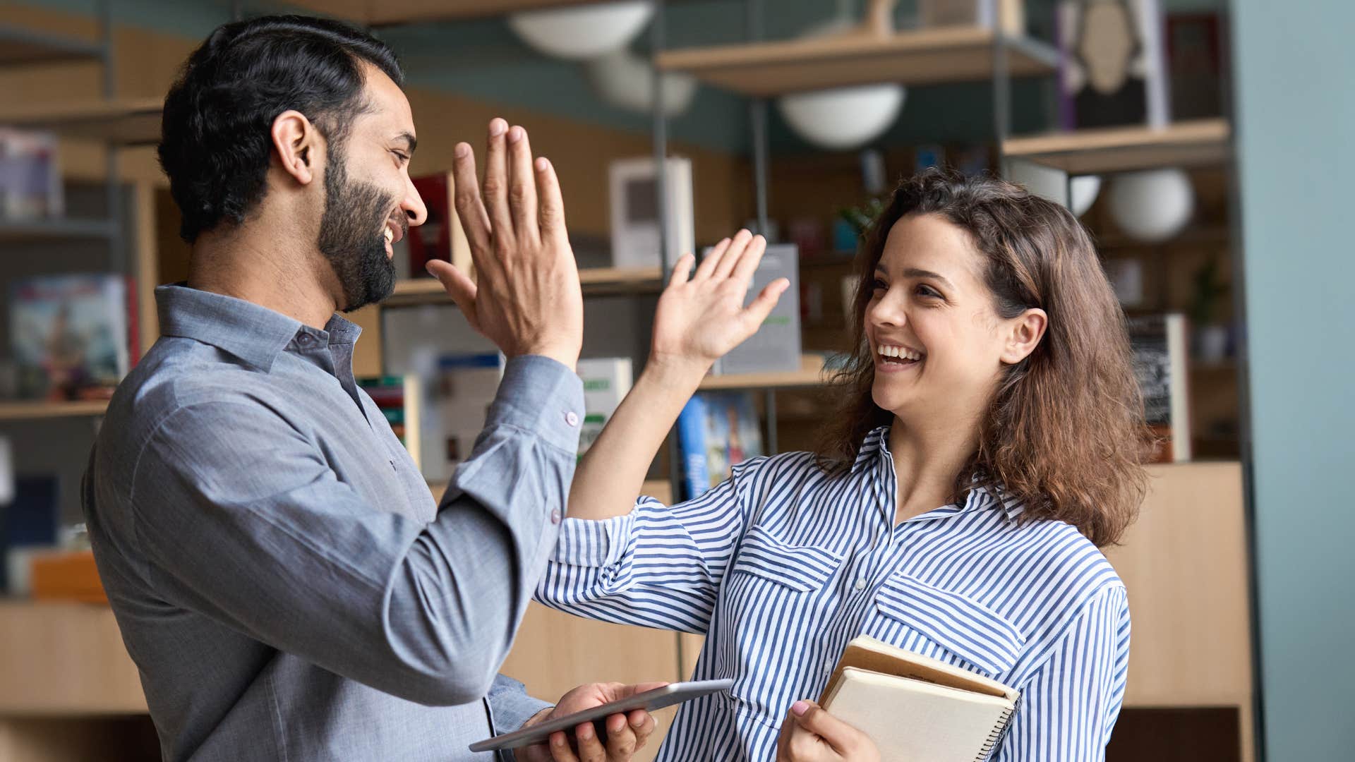 husband and wife celebrating after reaching a financial goal together