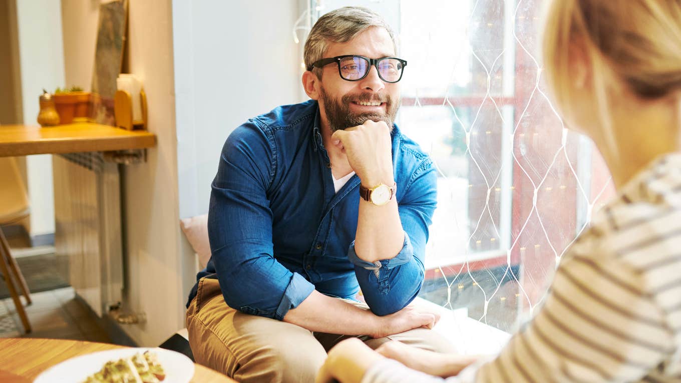 If You Want To Become More Compatible With Your Spouse As You Get Older, Say Hello To These Habits Spouse and partner sitting down talking.