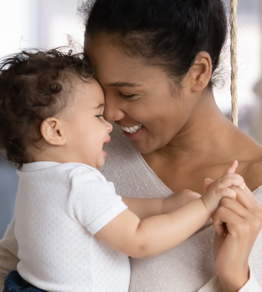 Mother and baby laughing