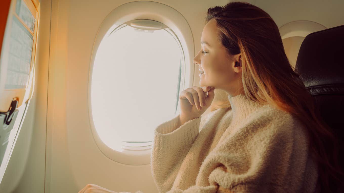 Passenger Refuses To Give Up Window Seat For Kid Throwing A Tantrum woman sitting in window seat on airplane