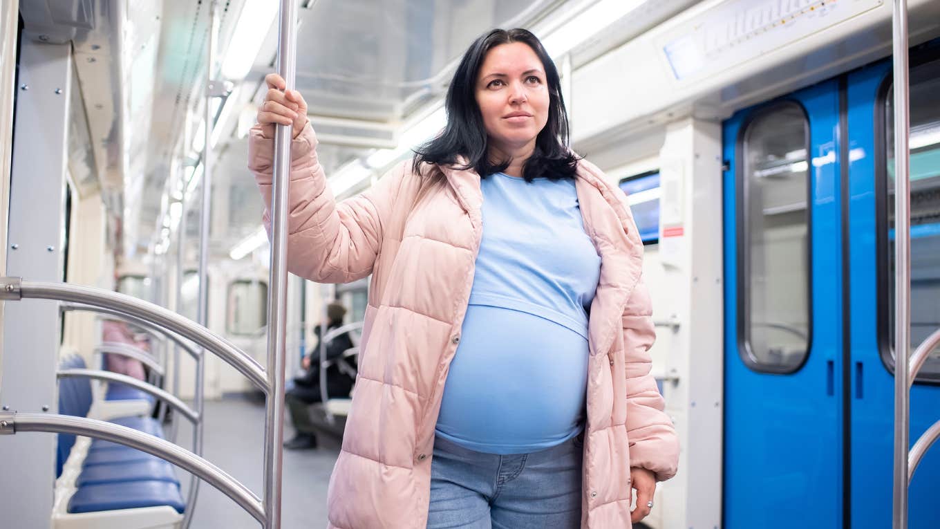 Pregnant Woman On Subway Wonders Why No Passengers Offer Her Their Seat pregnant woman standing on subway