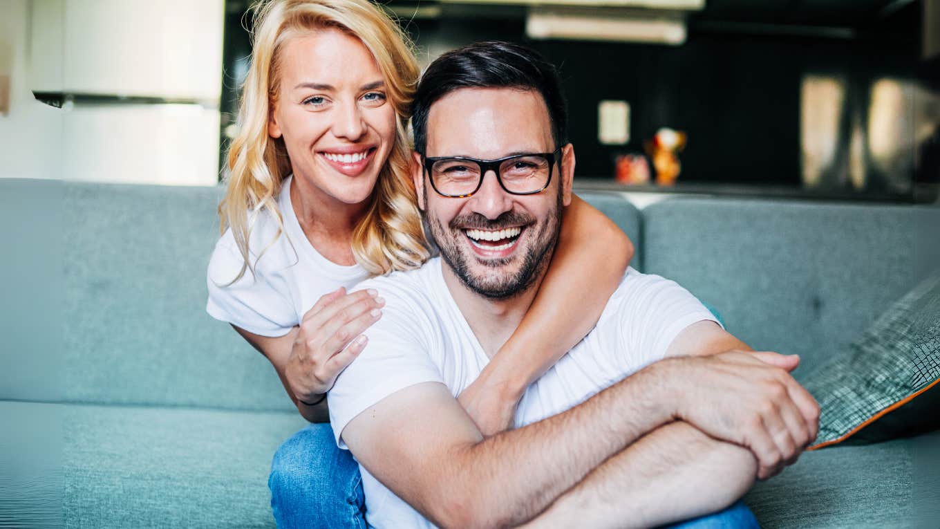 Psychology Says Wives Who Master These Skills Have The Happiest Husbands Wife loving on her happy husband.