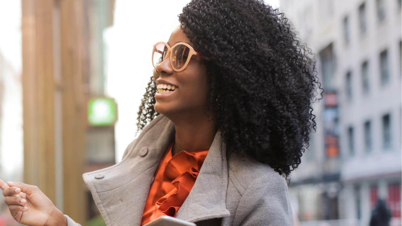 Things You Should Do For Your Relationship Health Every Morning, According To Psychology Woman does things in the morning for a healthy relationship.