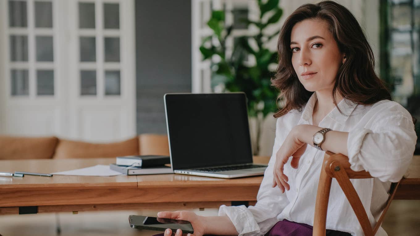 Signs Your Boss Wants You To Value Your Job More Than You Value Yourself stressed serious woman working from home