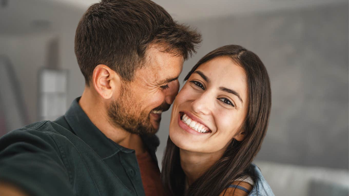 Signs Of A Supportive Partner Who Actually Cares About Your Feelings Happy couple smiling and hugging