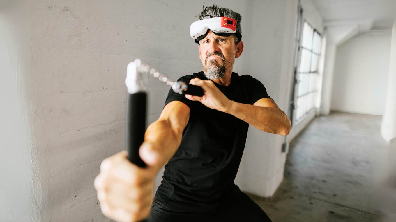 'Undateable' Habits Women Actually Find Very Attractive In Men Man wearing mask, playing with nunchucks.