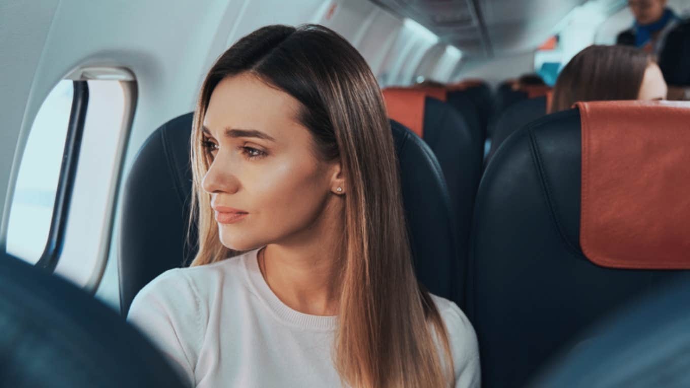 Passenger Shares The Heartwarming Lengths Delta Flight Staff Took To Ensure She'd Make It To Say Goodbye To Her Dying Mother woman looking out window on plane