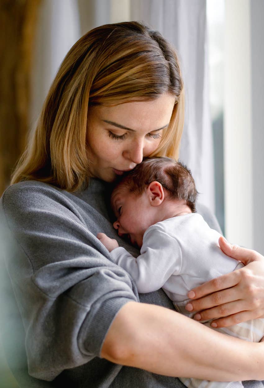 Loving mom holding her baby