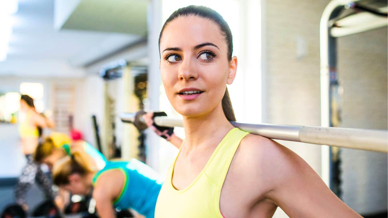 Research Says If You Do These Things, You're Healthier Than You Think You Are Healthy woman at gym.