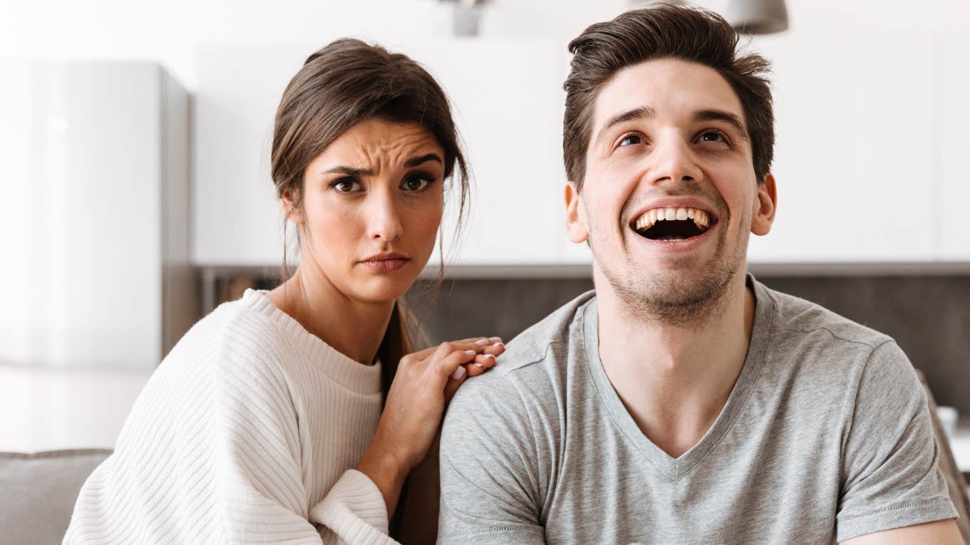 Signs Someone Will Be A Nightmare To Date, According To Psychology Man being a distracted nightmare, on date night.