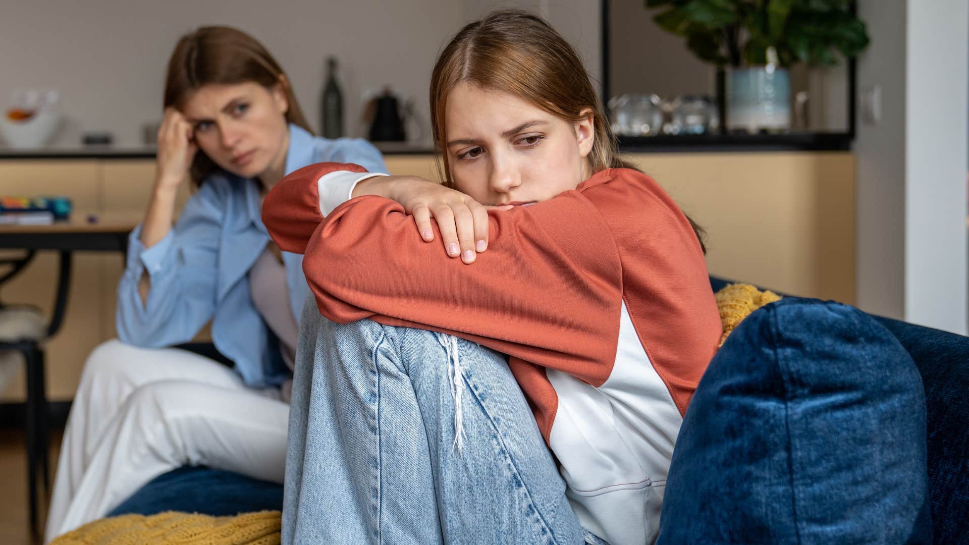 mom talking to upset teen about school pressure
