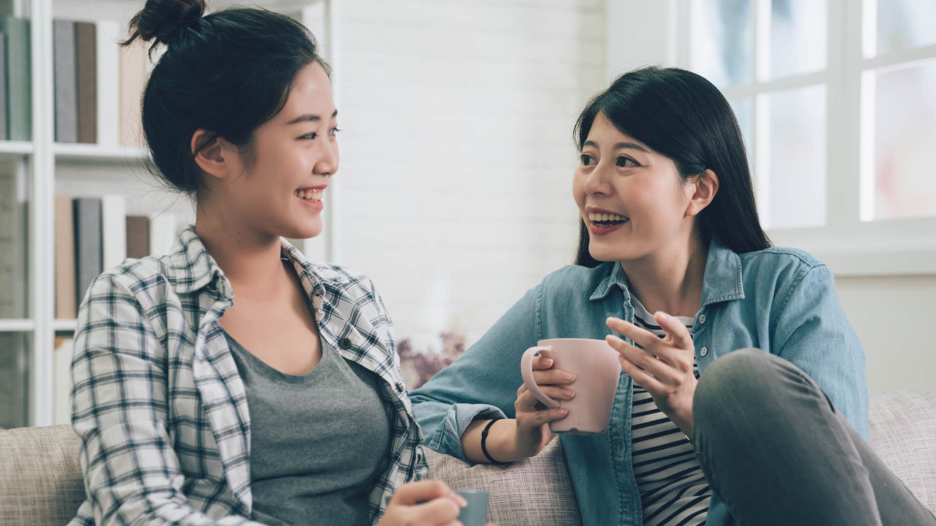 Two women smiling and talking to each other