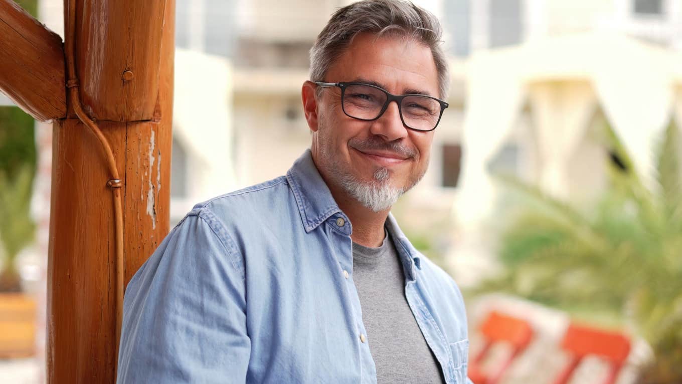 Frugal Gen X Habits People Make Fun Of Today That Actually Work Gen X man smiling and standing outside