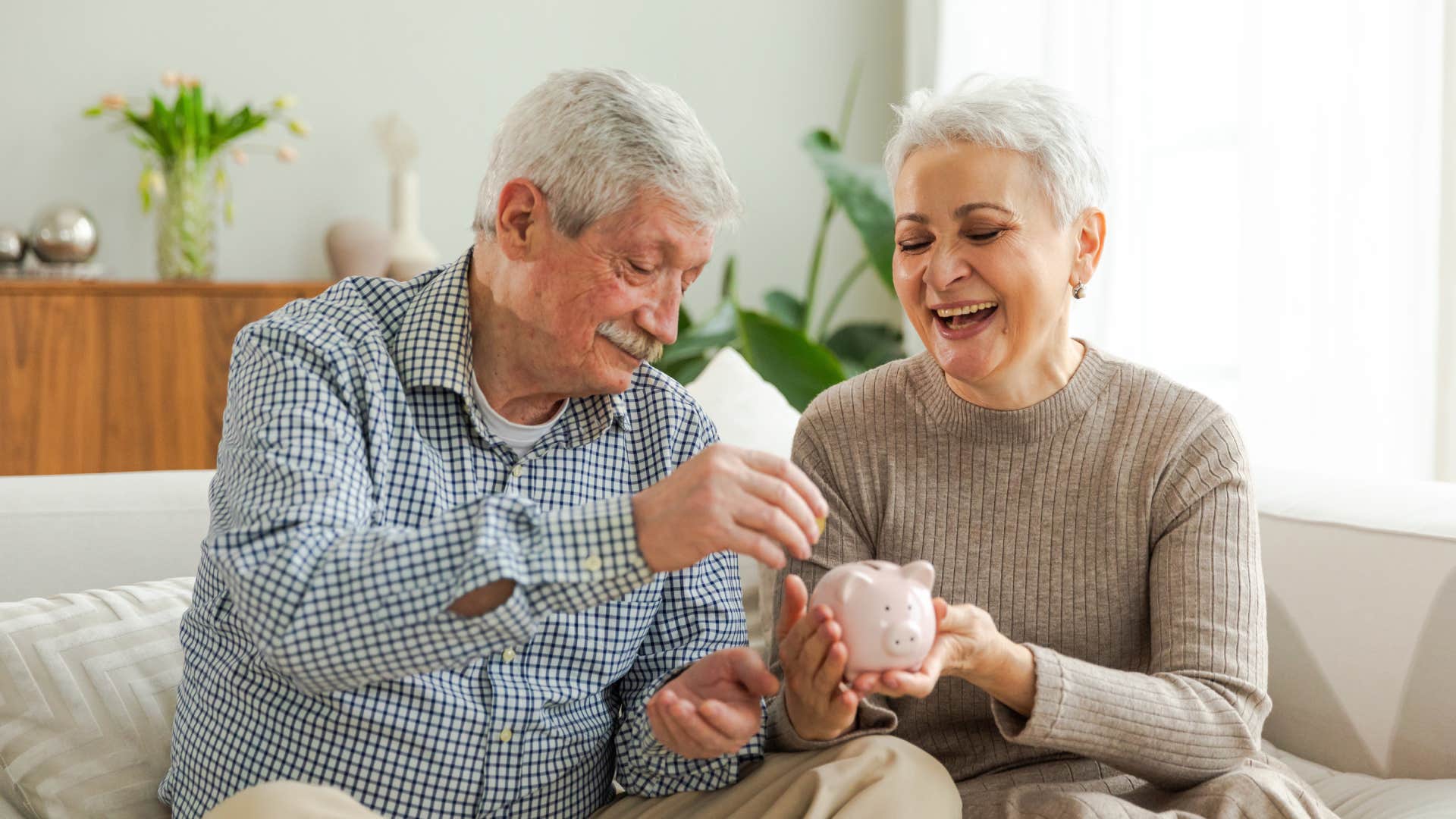 elderly couple saving money