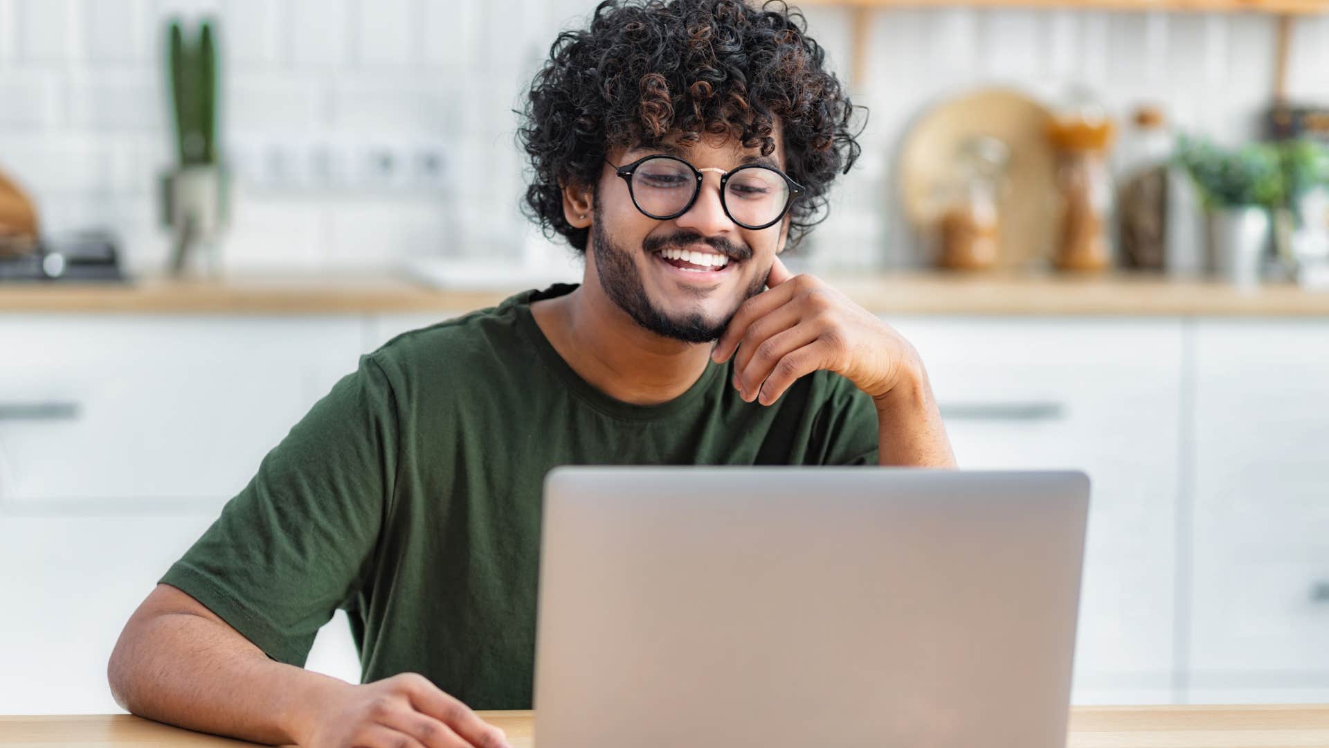 young man doing research on laptop
